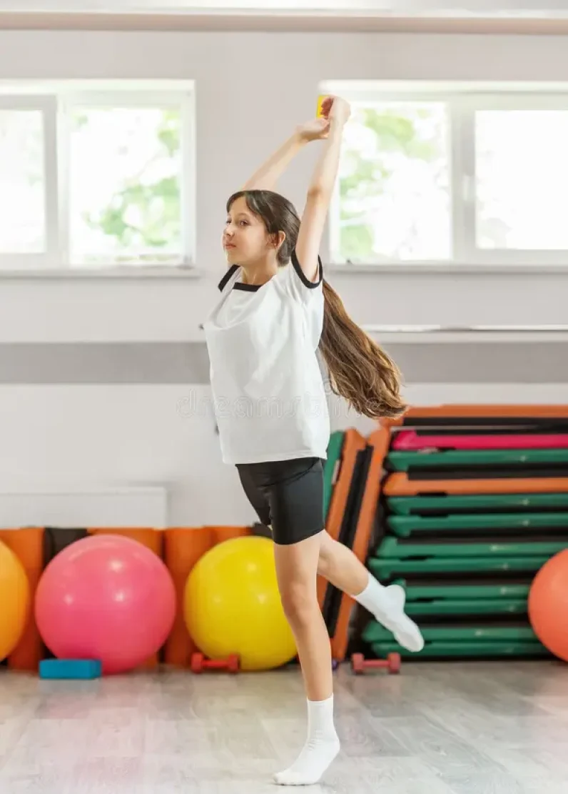 long-haired-girl-captured-mid-dance-jump-bright-fitness-studio-expressing-energy-grace-athletic-motion-teen-dancing-399553080
